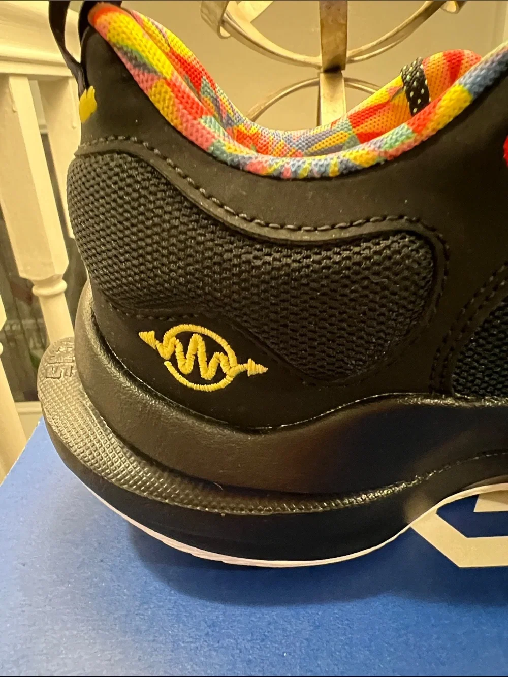 Nike Kids Black Sneakers with Yellow Accents and Multicolor Swoosh